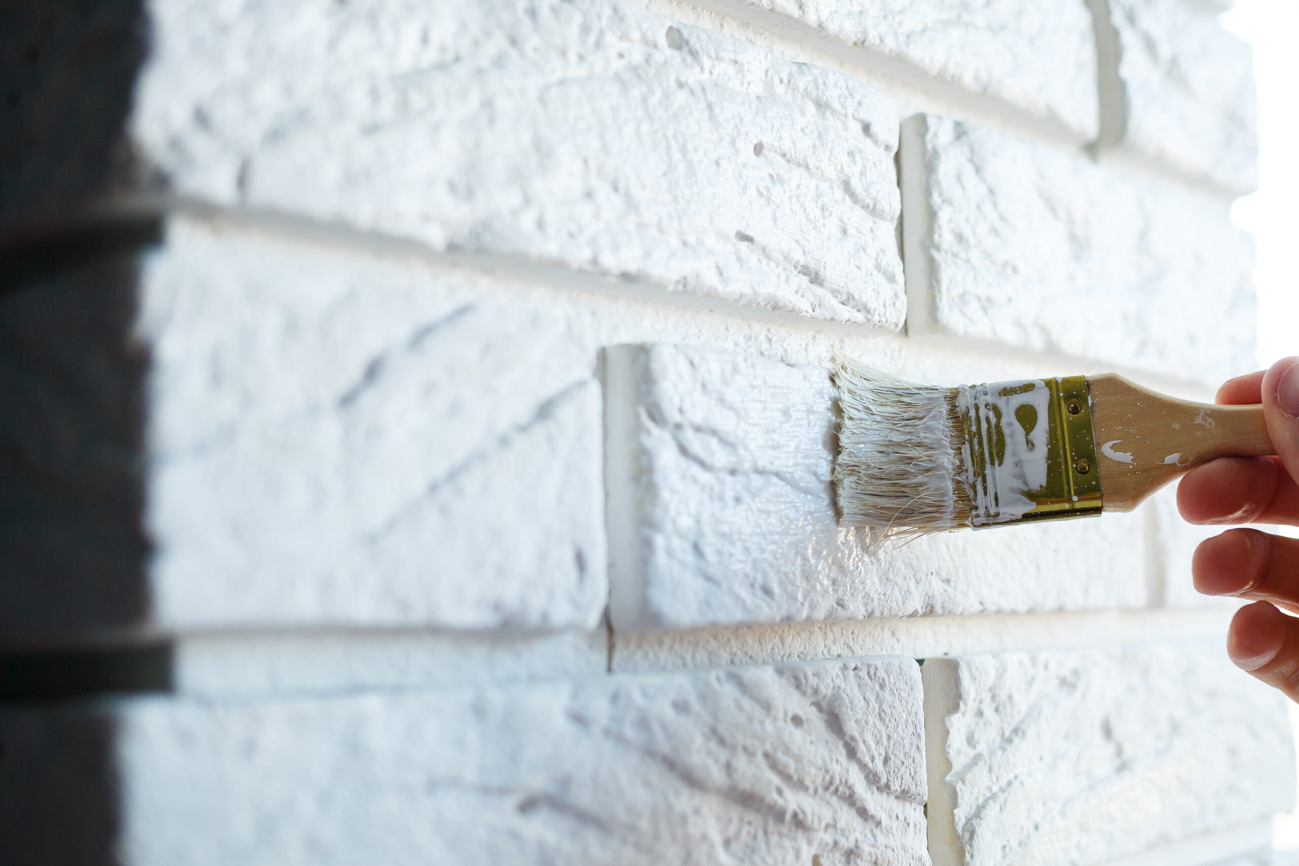 painting plaster decorative brick with white paint